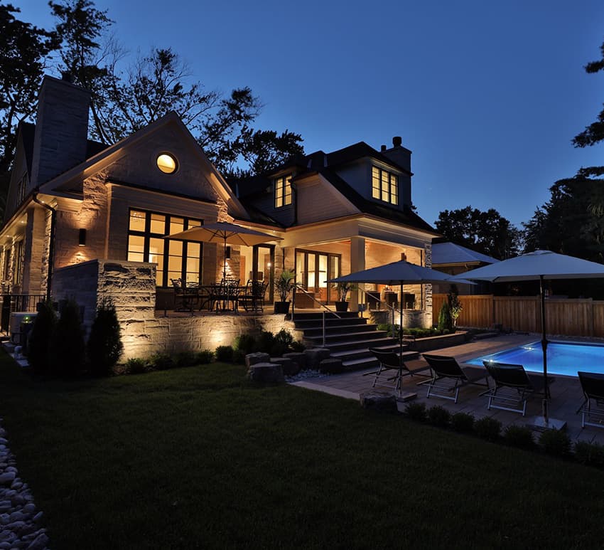 The Estate custom home with pool at dusk