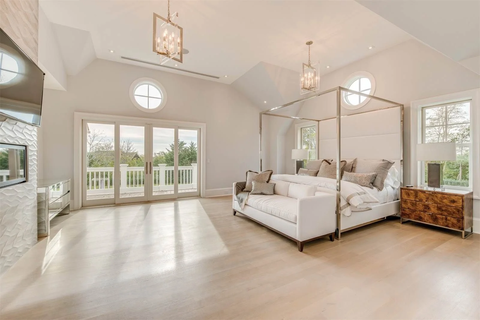 Bright primary bedroom with vaulted ceiling