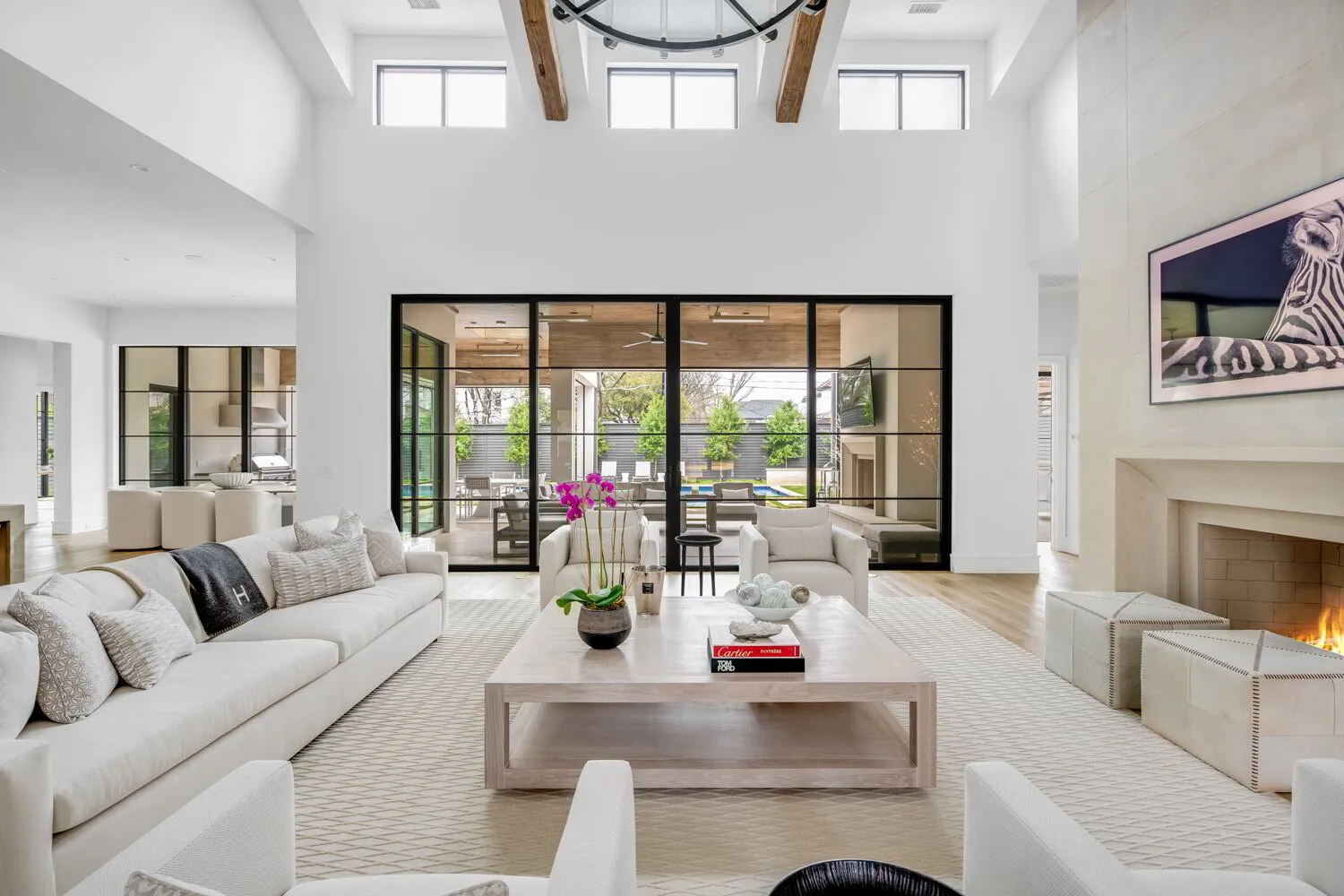 Bright open-concept living room with soaring ceilings
