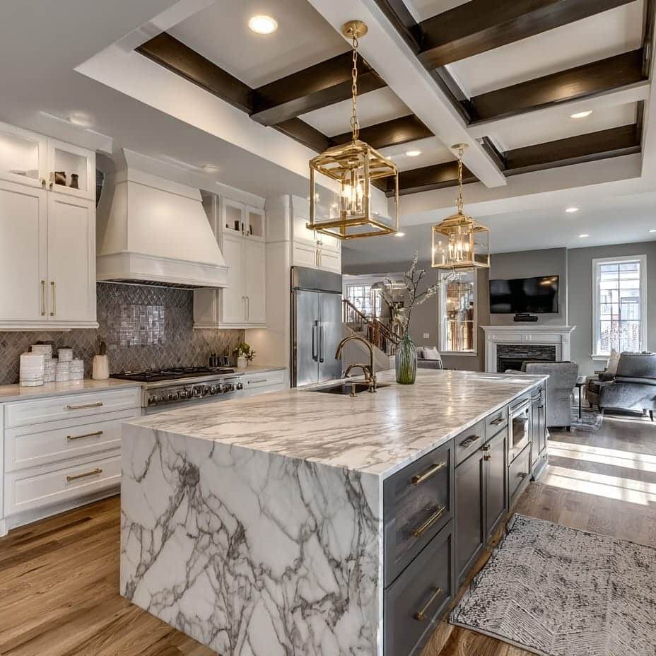 Marble island kitchen with coffered ceiling