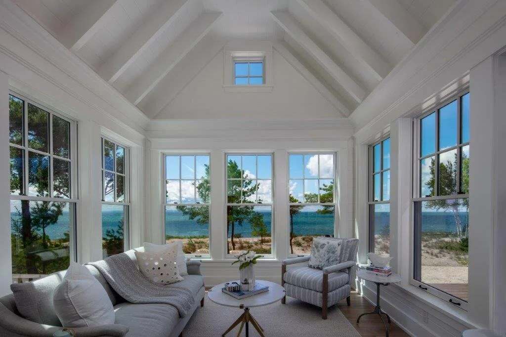 Bright sunroom with water views